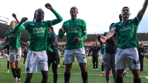 Plymouth Argyle players celebrate beating Liverpool