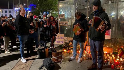 Musicians play at a vigil in Galway for Ashling Murphy
