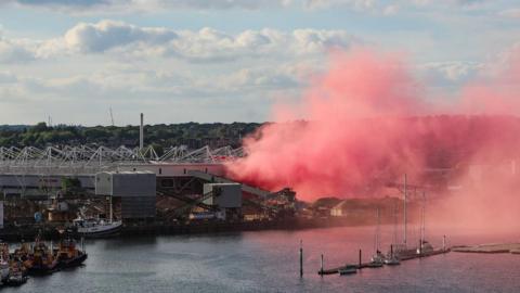 Giant red cloud of smoke outside St Mary's Stadium