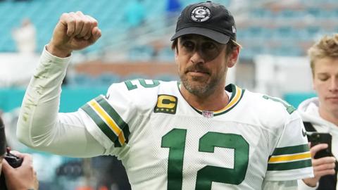 Quarterback Aaron Rodgers salutes the crowd