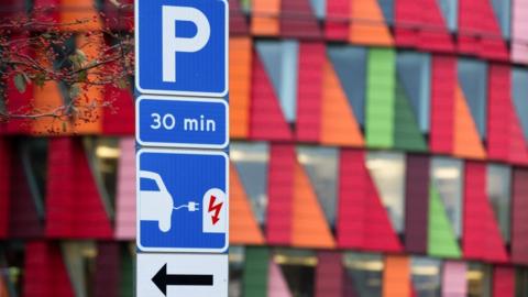 Electric car charging station sign seen in Lindholmen Science Park in Gothenburg.
