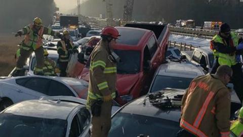 Damaged vehicles are seen after a crash on I-64 in York County, Virginia, December 22, 2019