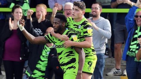 Jamille Matt and Matty Stevens celebrate scoring against Northampton in League Two