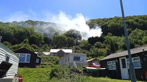 Smoke seen rising about properties in Clarach