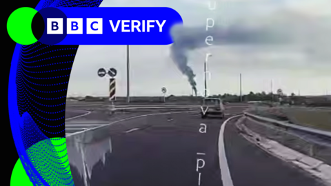 A frame from a verified video - filmed by a car dashcam - shows a smoke plume in the distance
