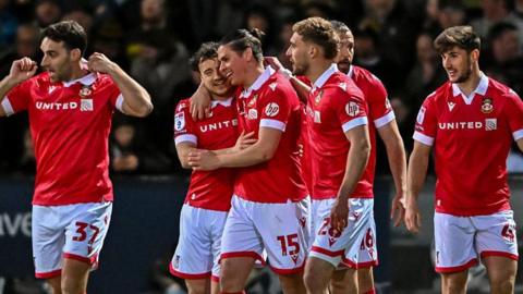 Wrexham celebrate George Dobson's goal against Cambridge earlier this month