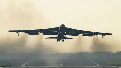 A United States Air Force B-52 Stratofortress strategic bomber takes off from RAF Fairford.
