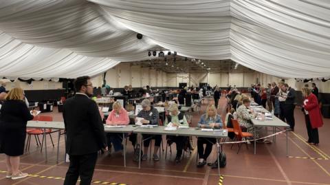People counting votes in room in Bassetlaw