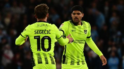 Adrian Segecic celebrates his consolation goal for Portsmouth at Coventry
