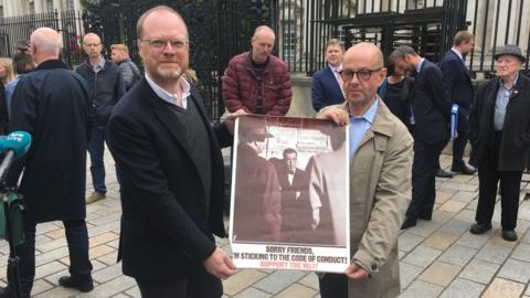 Trevor Birney and Barry McCaffrey with NUJ poster