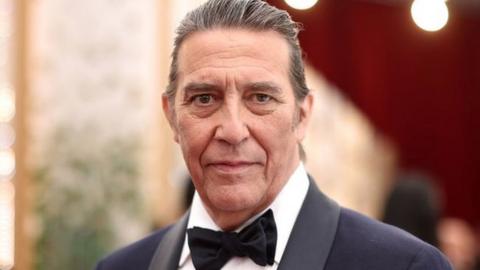 Ciarán Hinds on the red carpet at the 2022 Oscars in Hollywood