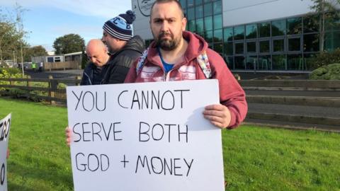 Protester outside Green Pastures Church in Ballymena