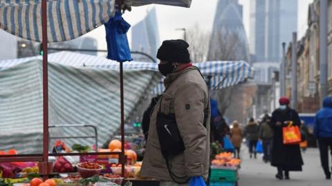 Man at market stall near City of London