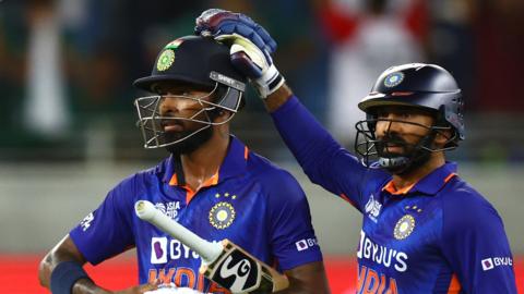 Hardik Pandya is congratulated by Dinesh Karthik