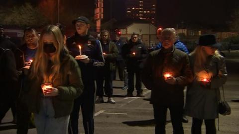 People gathered for a candlelit vigil