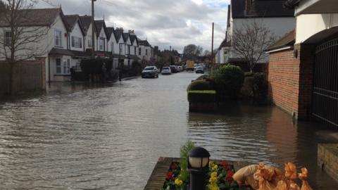 A flooded road in Thames Ditton