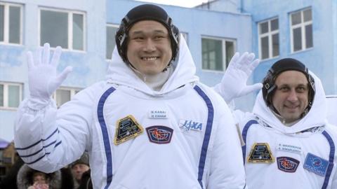 Members of the International Space Station expedition 54/55 Norishige Kanai (L) of the Japan Aerospace Exploration Agency (JAXA) and Roscosmos cosmonaut Anton Shkaplerov (R) during the send-off ceremony after checking their space suits before the launch of the Soyuz MS-07 spacecraft at the Baikonur cosmodrome, in Kazakhstan on 17 December 2017