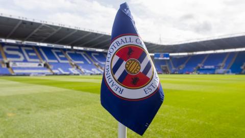 A corner flag basks in the sunshine at Reading's Select Car Leasing stadium.