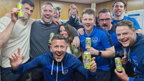 Staff from Portsmouth FC and Staggeringly Good Brewery