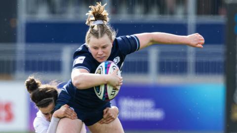 Scotland's Meryl Smith is tackled by France's Gabrielle