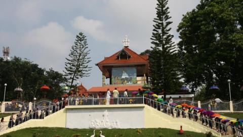 Indian Christian devotees queue to pray at the tomb of Sister Alphonsa in Pala, some 70kms south-east of Kochi on October 11, 2008.