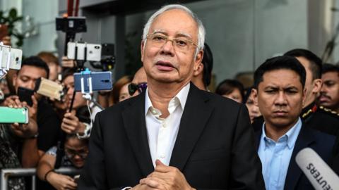 Malaysia"s former prime minister Najib Razak speaks to the media after being questioned at the Malaysian Anti-Corruption Commission (MACC)