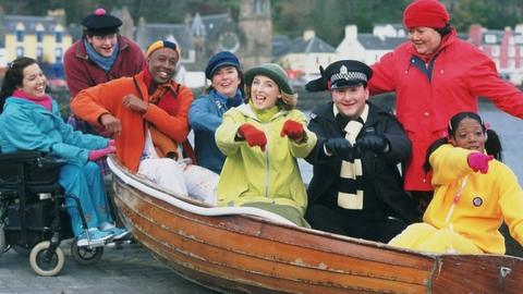 The cast of Balamory with Tobermory in the background
