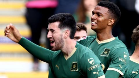 Finn Azaz (left) and Morgan Whittaker celebrate at goal against Norwich City