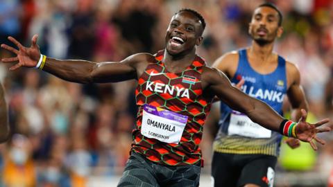 Ferdinand Omanyala celebrates after winning the 100m at the Commonwealth Games