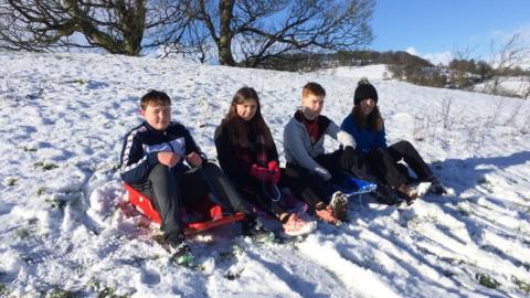 Children on sledges near Bala