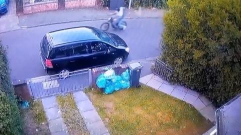 CCTV footage of people riding bicycle