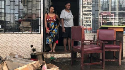 Business owners at their property after flooding from Tropical Cyclone Josie in Fiji