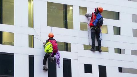 Protesters scale the Home Office