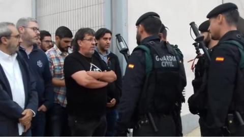 Police and locals in Sant Joan de Vilatorrada