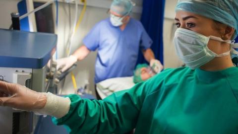 file picture of anaesthetic specialists and operation