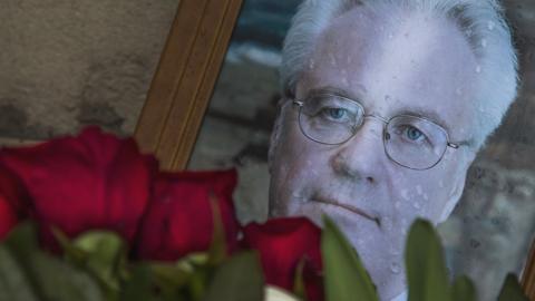 Flowers are placed by a portrait of the late Russian Ambassador to the United Nations Vitaly Churkin, outside the Foreign Ministry headquarters in Moscow, Russia, 21 February 2017