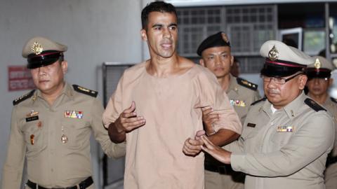 Hakeem Al-Araibi led by policemen