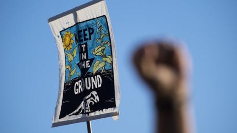 This is a photo of a placard protesting the development of the Dakota Access pipeline.