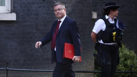 Welsh Secretary Robert Buckland pictured walking along Downing Street