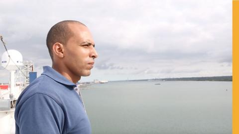 A seafarer looks out over the sea