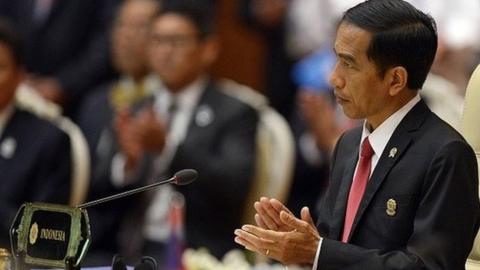 Indonesian President Joko Widodo applauds during the plenary session of the 25th ASEAN Summit at the Myanmar International Convention Center in Myanmar's capital Naypyidaw on November 12, 2014