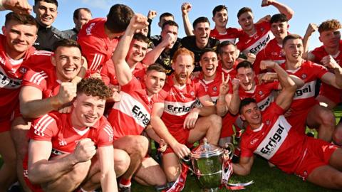 Derry players celebrate after the final whistle