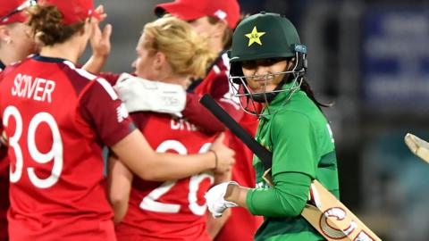 Pakistan captain Bismah Maroof walks off as England players celebrate her dismissal