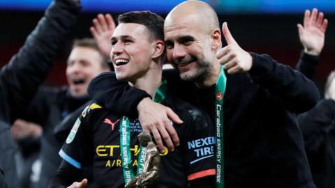 Phil Foden with Pep Guardiola