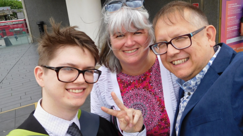 Oli Amess and his parents