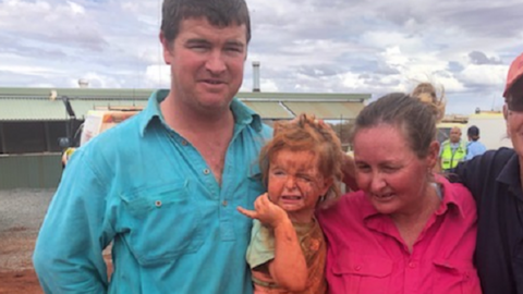 A girl and her family after she was found in the Australian outback