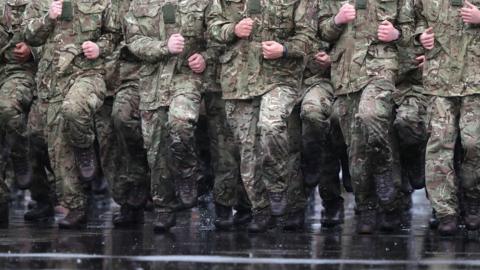 Troops training in the rain