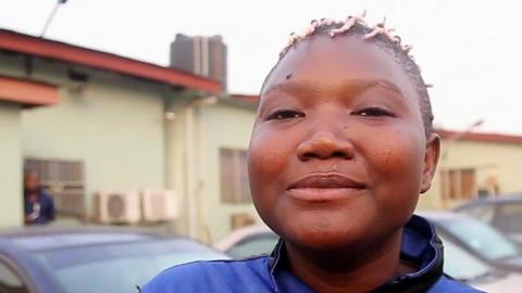 Nigerian woman with pink braided hair