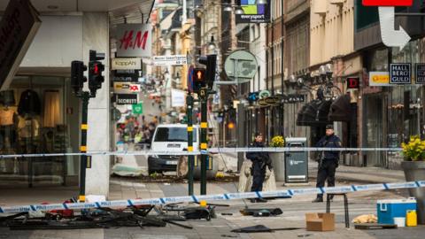 Debris at the scene of the terrorist attack where a truck crashed after driving down a pedestrian street in downtown Stockholm on April 8, 2017