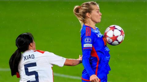 Ada Hegerberg controls the ball with her chest